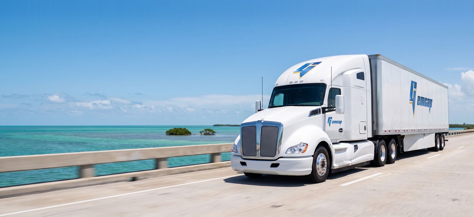 A GEMCAP tractor-trailer crossing the Seven Mile Bridge in the Florida Keys over turquoise water
